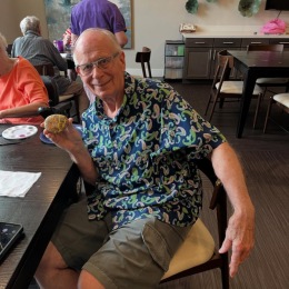 a person holding a decorated rock
