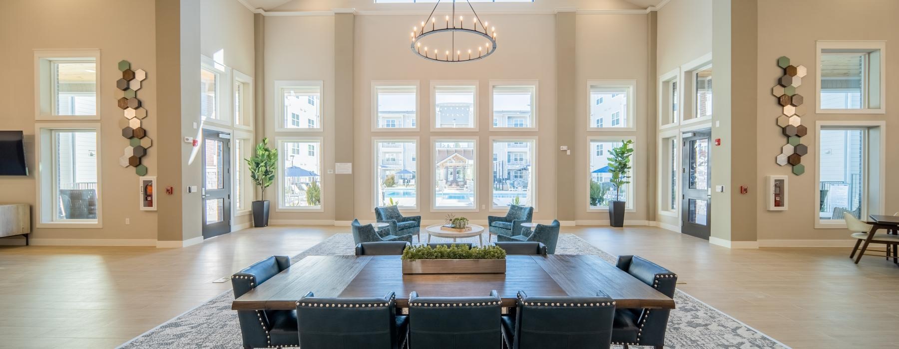 a room with a large table and chairs