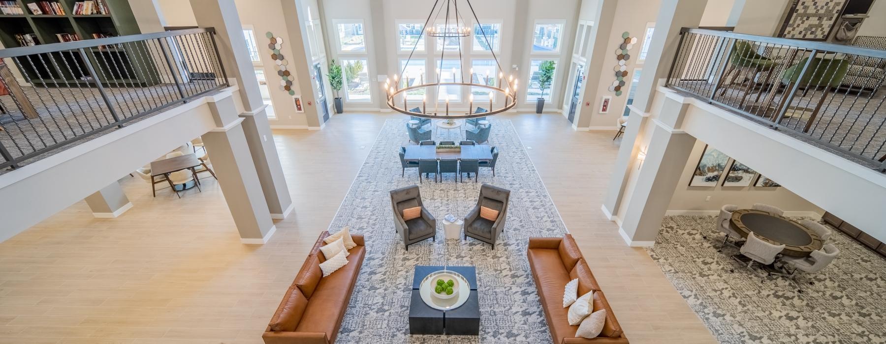 a two-story lounge with seating and tables